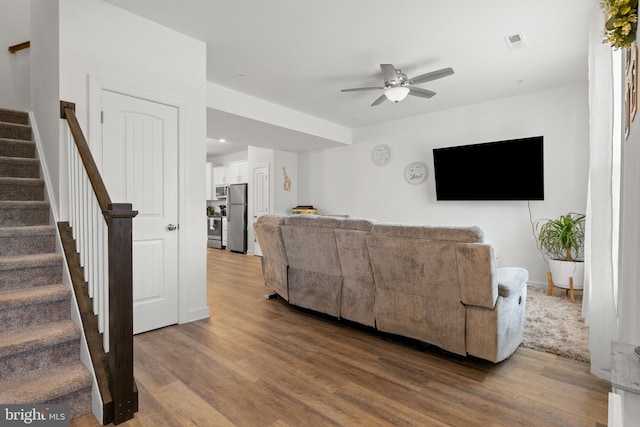 12 Parkview Dr, Carlisle, PA 17013 - living room featuring ceiling fan, stairway, and wood finished floors