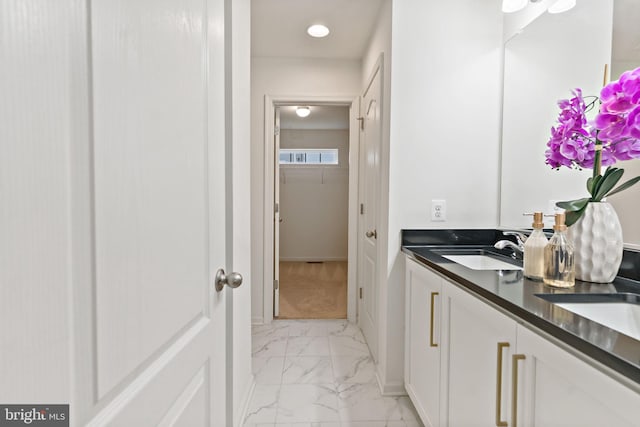 127 Stager Ave, Falling Waters, WV 25419 - bathroom featuring marble look tiles, double vanity, baseboards, recessed lighting, and a closet