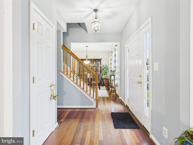 7 Meadow Lark Dr, Milford, DE 19963 - entryway with wood-type flooring, stairway, plenty of natural light, and baseboards