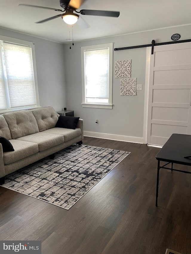 209 Hewitt Rd, Williamstown, NJ 08094 - living area featuring ceiling fan, a barn door, baseboards, and dark wood-style flooring