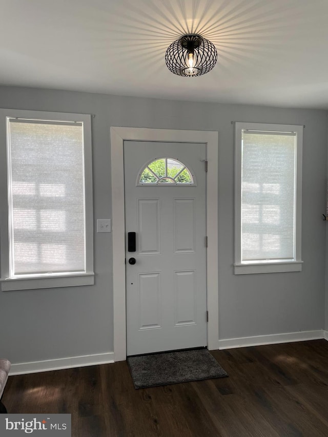 209 Hewitt Rd, Williamstown, NJ 08094 - foyer with baseboards and dark wood finished floors