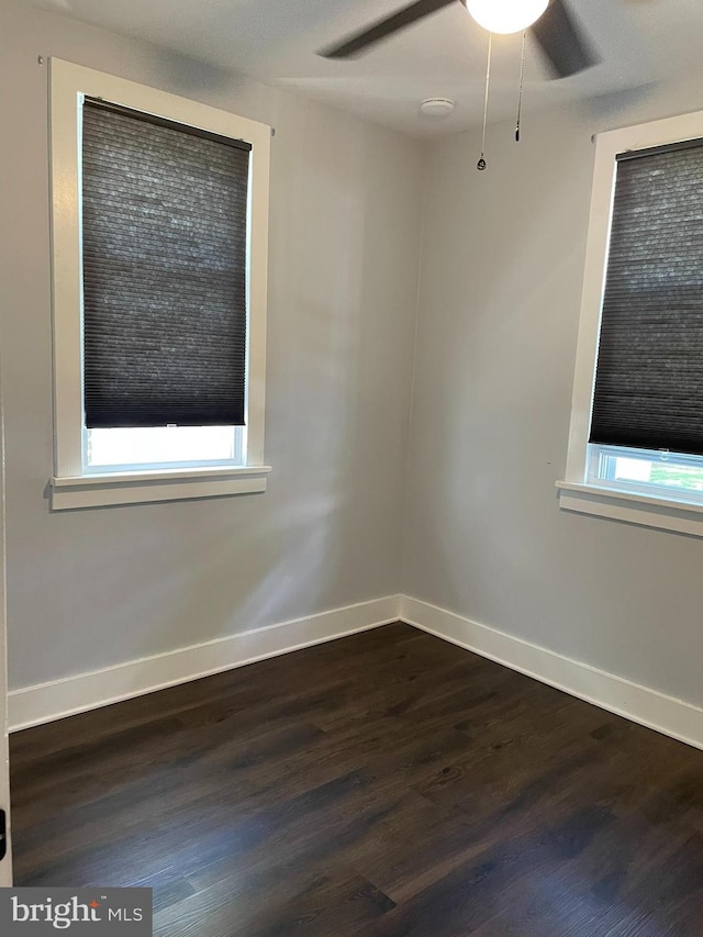 209 Hewitt Rd, Williamstown, NJ 08094 - unfurnished room with a ceiling fan, dark wood-type flooring, and baseboards