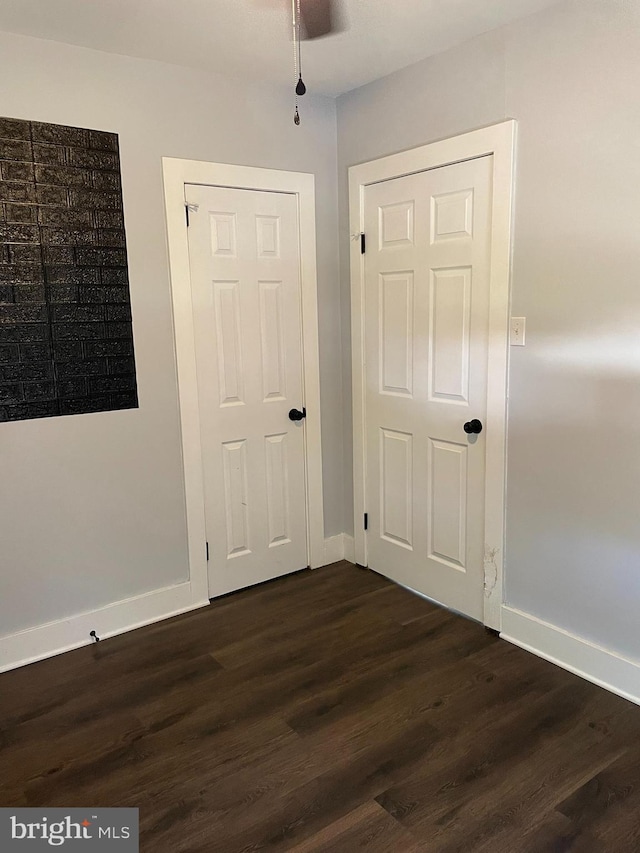 209 Hewitt Rd, Williamstown, NJ 08094 - spare room with dark wood-style flooring, baseboards, and ceiling fan