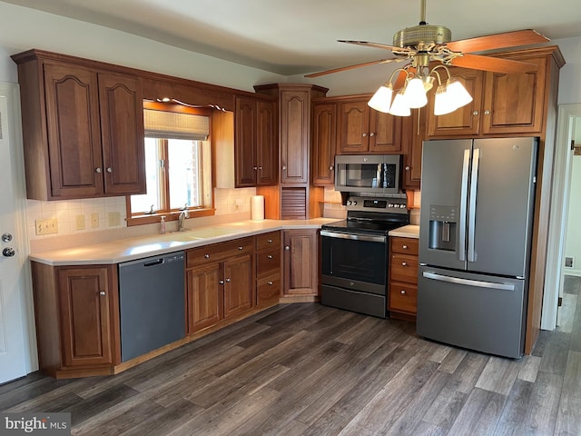 209 S Cherry St, Myerstown, PA 17067 - kitchen with stainless steel appliances, a sink, a ceiling fan, and dark wood-style flooring