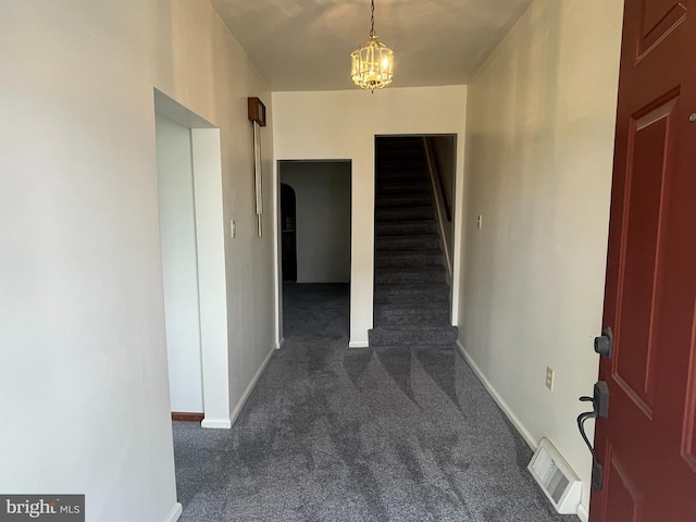 209 S Cherry St, Myerstown, PA 17067 - hall featuring dark carpet, stairs, a chandelier, and baseboards