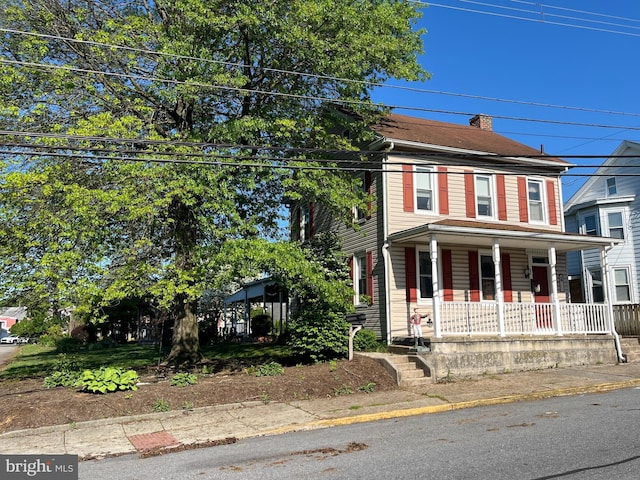 209 S Cherry St, Myerstown, PA 17067 - view of front of property with covered porch and a chimney