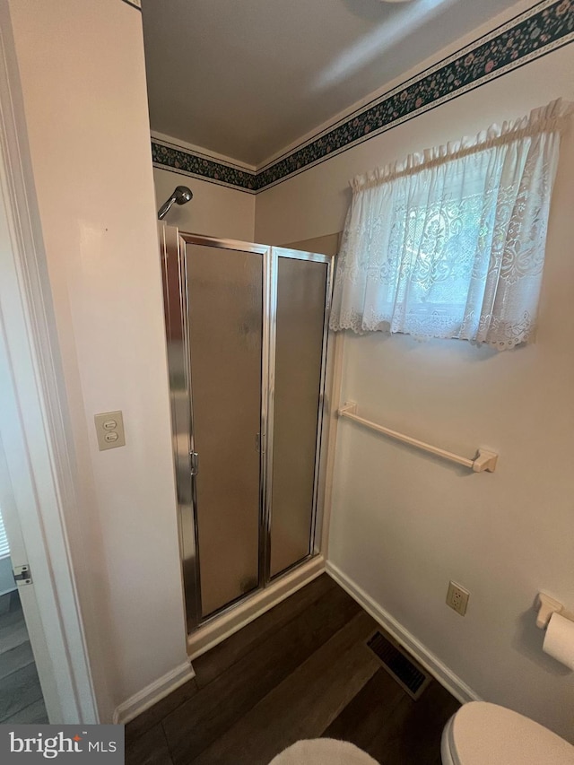 209 S Cherry St, Myerstown, PA 17067 - full bath with a shower stall, toilet, wood finished floors, and baseboards