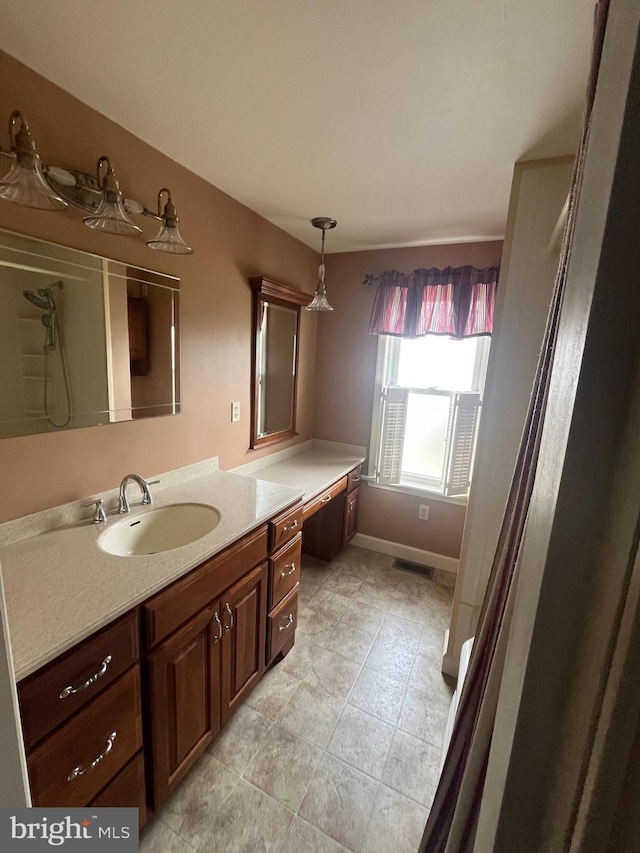 209 S Cherry St, Myerstown, PA 17067 - full bath with vanity, tile patterned flooring, and baseboards