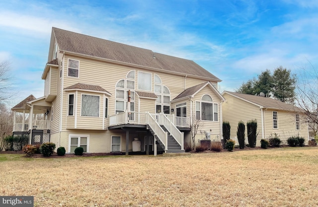 5 Cross Point Dr, Owings, MD 20736 - back of house featuring a yard, stairs, and roof with shingles