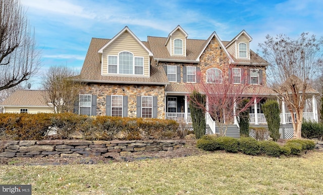 5 Cross Point Dr, Owings, MD 20736 - view of front of property featuring stone siding, a front lawn, and a porch