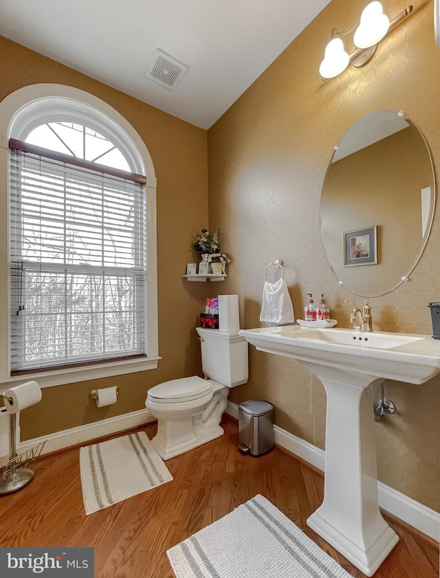 5 Cross Point Dr, Owings, MD 20736 - bathroom featuring baseboards, wood finished floors, and toilet