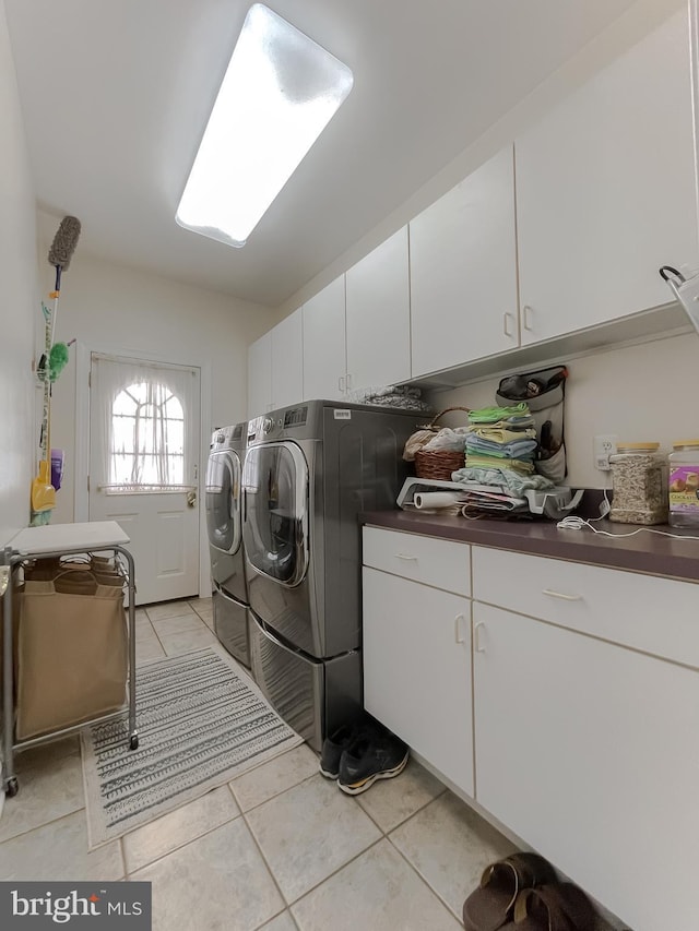 5 Cross Point Dr, Owings, MD 20736 - laundry room featuring cabinet space, washing machine and clothes dryer, and light tile patterned floors