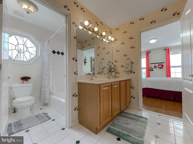 5 Cross Point Dr, Owings, MD 20736 - bathroom with tile patterned flooring, toilet, double vanity, shower / bathtub combination with curtain, and ensuite bathroom