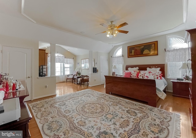 5 Cross Point Dr, Owings, MD 20736 - bedroom with ornate columns, multiple windows, light wood finished floors, lofted ceiling, and a ceiling fan
