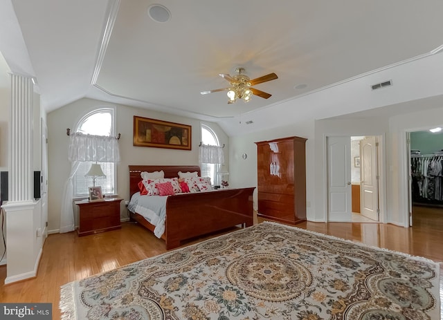 5 Cross Point Dr, Owings, MD 20736 - bedroom featuring light wood-style flooring, vaulted ceiling, a walk in closet, a ceiling fan, and baseboards