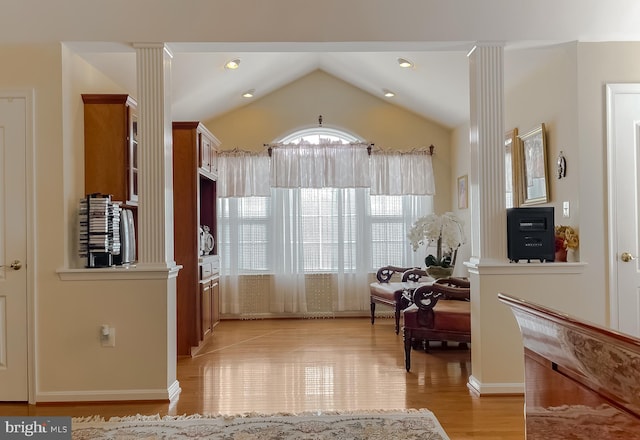 5 Cross Point Dr, Owings, MD 20736 - kitchen featuring ornate columns, light wood-style flooring, lofted ceiling, and brown cabinetry