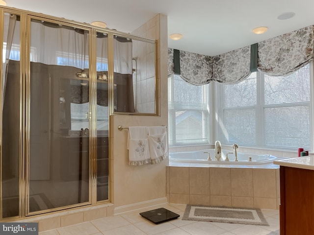 5 Cross Point Dr, Owings, MD 20736 - bathroom with tile patterned floors, a garden tub, a shower stall, vanity, and baseboards