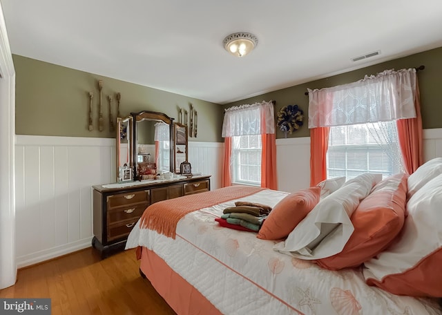 5 Cross Point Dr, Owings, MD 20736 - bedroom with a wainscoted wall and light wood-style floors
