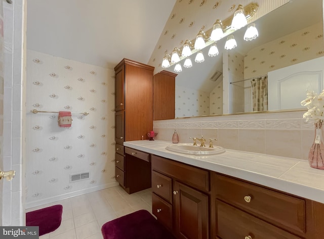 5 Cross Point Dr, Owings, MD 20736 - bathroom with wallpapered walls, lofted ceiling, vanity, tile patterned floors, and a shower with shower curtain