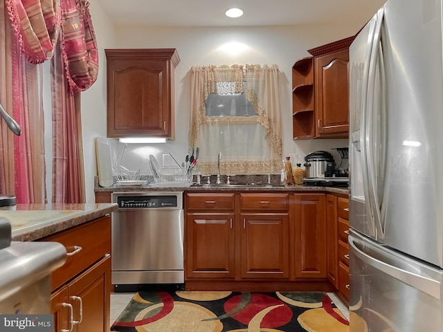 5 Cross Point Dr, Owings, MD 20736 - kitchen with stainless steel appliances, stone counters, a sink, recessed lighting, and brown cabinets