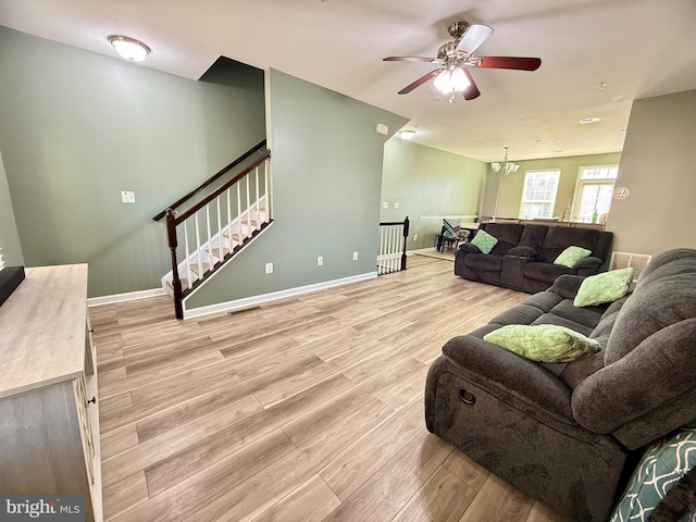 7423 Rigby Pl, Elkridge, MD 21075 - living area with light wood-type flooring, ceiling fan, and baseboards