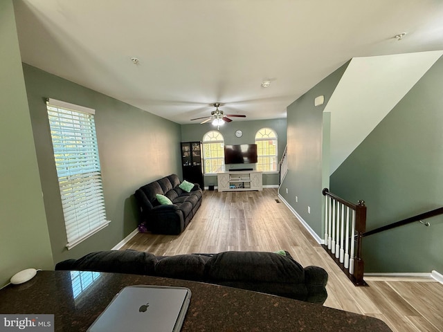 7423 Rigby Pl, Elkridge, MD 21075 - living room with wood finished floors, healthy amount of natural light, and baseboards