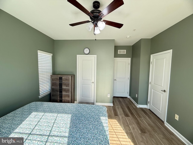 7423 Rigby Pl, Elkridge, MD 21075 - unfurnished bedroom featuring wood finished floors, baseboards, and ceiling fan