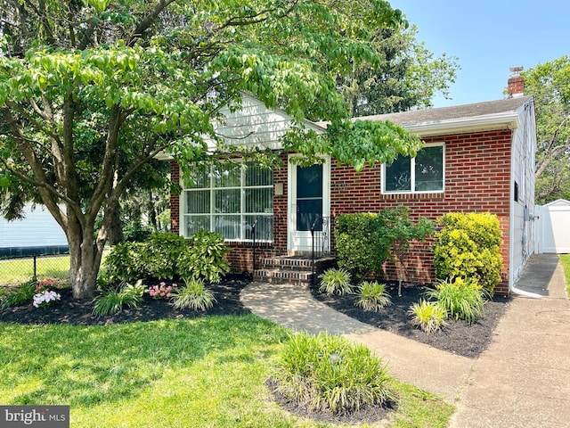 7129 Chandler Ave, Pennsauken, NJ 08110 - view of front facade with brick siding and a chimney