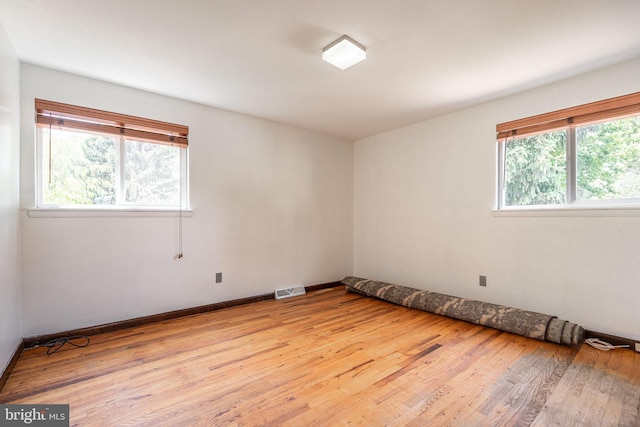 7129 Chandler Ave, Pennsauken, NJ 08110 - unfurnished room with plenty of natural light, light wood-type flooring, and baseboards