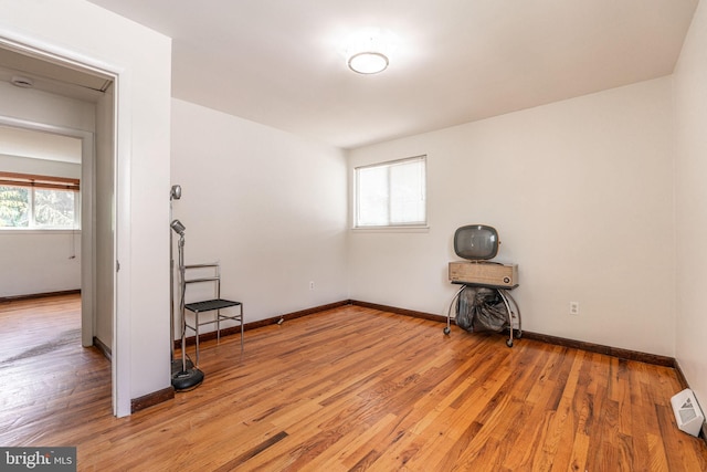 7129 Chandler Ave, Pennsauken, NJ 08110 - unfurnished room featuring plenty of natural light, light wood-style floors, and baseboards