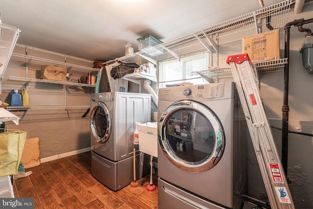 7129 Chandler Ave, Pennsauken, NJ 08110 - washroom featuring washer and dryer, wood finished floors, and baseboards