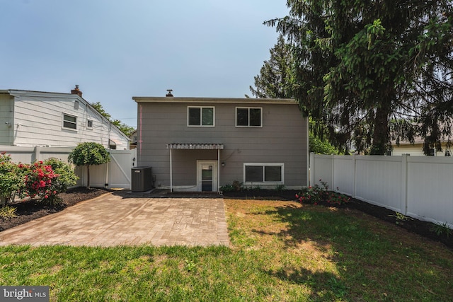 7129 Chandler Ave, Pennsauken, NJ 08110 - back of house with a patio area, a gate, and central AC