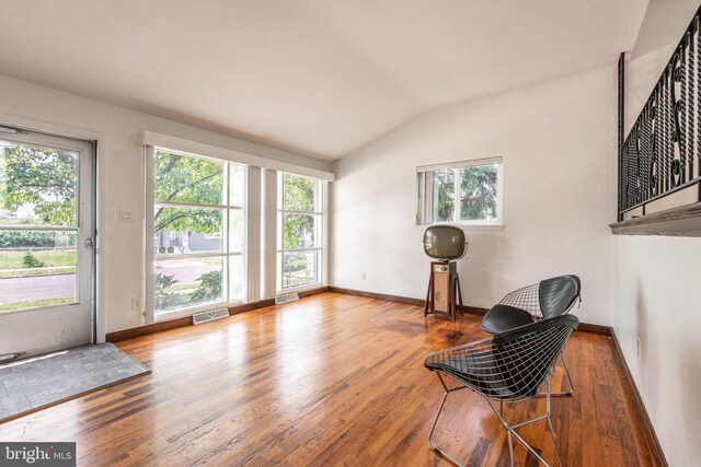 7129 Chandler Ave, Pennsauken, NJ 08110 - living area with lofted ceiling, wood finished floors, baseboards, and stairway