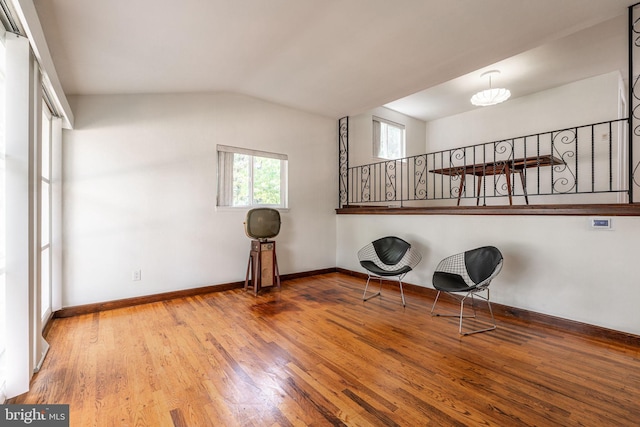 7129 Chandler Ave, Pennsauken, NJ 08110 - living area featuring wood finished floors, baseboards, and lofted ceiling