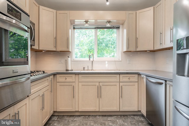 7129 Chandler Ave, Pennsauken, NJ 08110 - kitchen featuring a sink, appliances with stainless steel finishes, a warming drawer, and tasteful backsplash