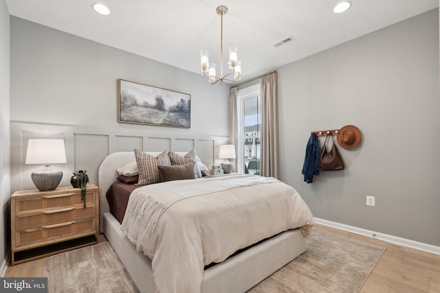1052 Webster Ct, Winchester, VA 22603 - bedroom with a chandelier, light wood finished floors, recessed lighting, and baseboards