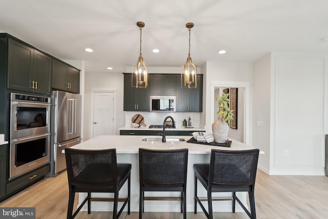 1052 Webster Ct, Winchester, VA 22603 - kitchen featuring stainless steel appliances, a sink, tasteful backsplash, light countertops, and a breakfast bar