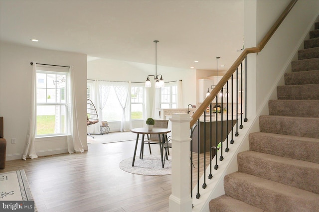 6300 Neha Dr Unit 32, Mechanicsburg, PA 17050 - stairway featuring wood finished floors, healthy amount of natural light, a chandelier, recessed lighting, and baseboards