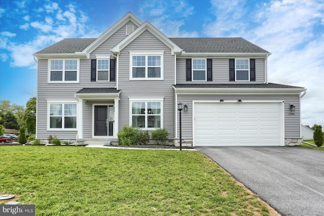 6300 Neha Dr Unit 32, Mechanicsburg, PA 17050 - view of front of home featuring asphalt driveway, an attached garage, and a front lawn