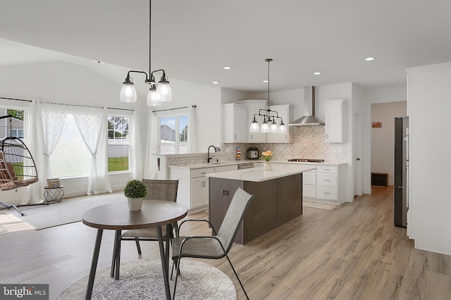 6300 Neha Dr Unit 32, Mechanicsburg, PA 17050 - dining area with light wood-style flooring, a chandelier, recessed lighting, and vaulted ceiling