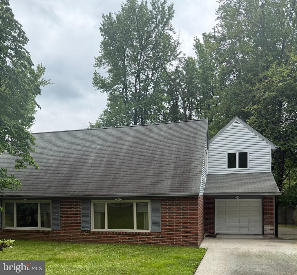 1927 Chapel Ave W, Cherry Hill, NJ 08002 - view of front of house with brick siding, a front lawn, concrete driveway, and roof with shingles