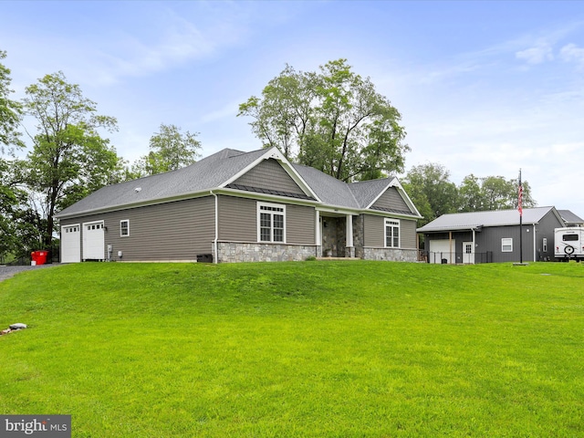 3447 Old Leetown Pike, Ranson, WV 25438 - view of front of house featuring a front yard, a garage, and stone siding