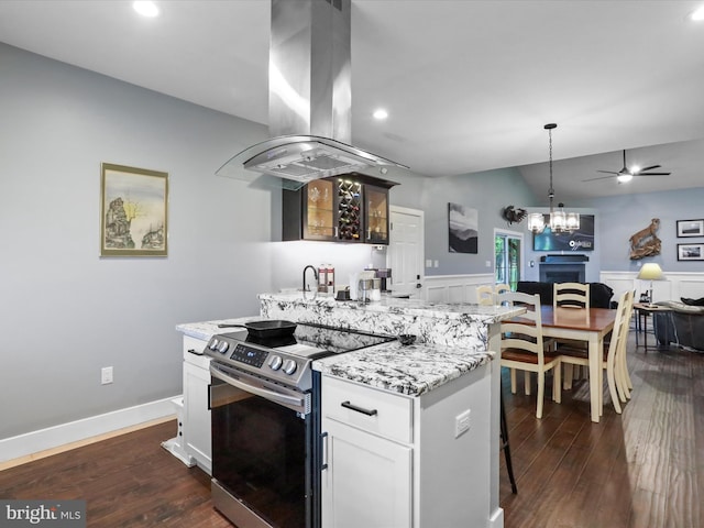 3447 Old Leetown Pike, Ranson, WV 25438 - kitchen featuring electric stove, island range hood, open floor plan, ceiling fan, and dark wood-style floors