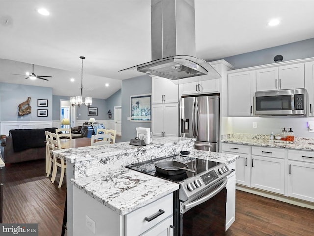 3447 Old Leetown Pike, Ranson, WV 25438 - kitchen with appliances with stainless steel finishes, island exhaust hood, open floor plan, white cabinets, and a wainscoted wall