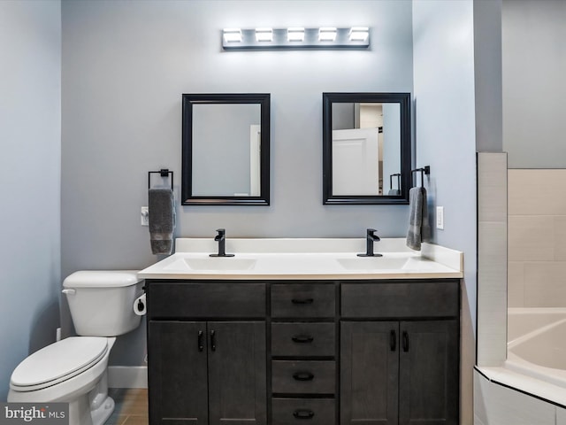 3447 Old Leetown Pike, Ranson, WV 25438 - bathroom featuring double vanity, toilet, and a bathtub