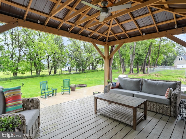 3447 Old Leetown Pike, Ranson, WV 25438 - wooden deck with an outdoor living space with a fire pit, a ceiling fan, a gazebo, and view of scattered trees