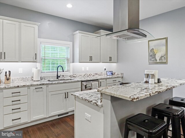 3447 Old Leetown Pike, Ranson, WV 25438 - kitchen with a sink, island exhaust hood, a kitchen breakfast bar, dark wood finished floors, and stainless steel dishwasher