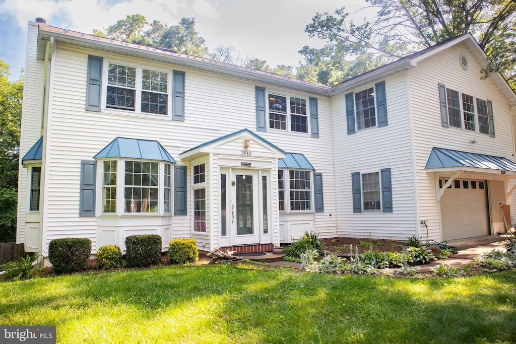 3910 Quisenberry Dr, Alexandria, VA 22309 - view of front of house with an attached garage and a front yard
