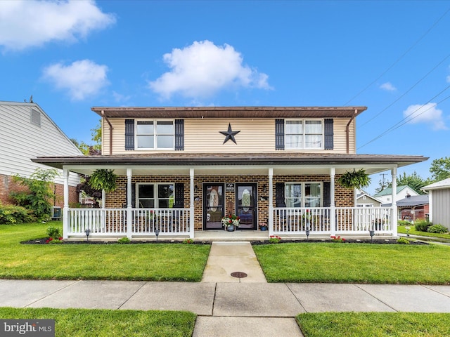 41 E Frederick St, Williamsport, MD 21795 - view of front facade with brick siding, covered porch, and a front lawn