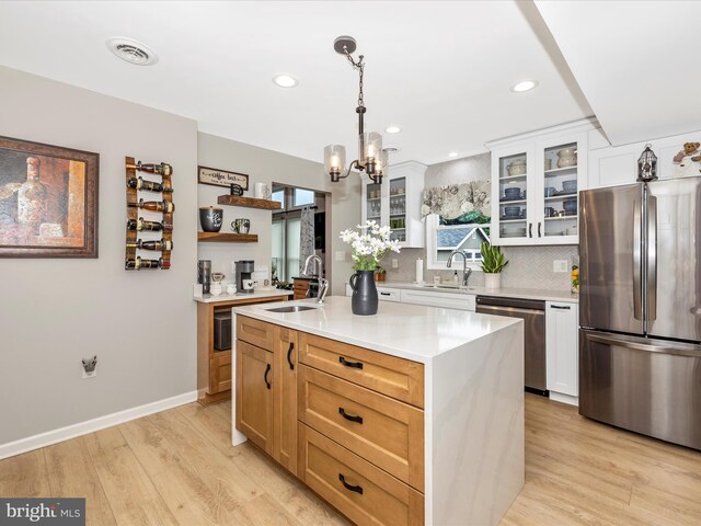 41 E Frederick St, Williamsport, MD 21795 - kitchen featuring stainless steel appliances, a sink, a chandelier, backsplash, and recessed lighting